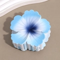 Detail of blue gradient plumeria hair claw clip with matte finish on sandy background - Sakura Blue Navy Stamen