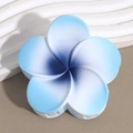 Macro view of blue gradient frangipani hair claw clip with matte finish and white teeth - Plumeria Blue Navy Stamen