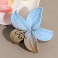 Detail of flower hair claw clip with blue and brown gradient finish and dotted texture - Blue Brown Gradient Frangipani