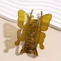 Elegant butterfly-shaped amber green hair claw clip with glossy acrylic finish and strong spring - Large Yellow Green