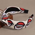 Detail view of knitted Santa Claus headband with twist knot design and soft texture - Plain Style