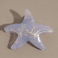 Close-up of starfish hair claw with purple gradient and gold glitter texture - Light Grey Purple