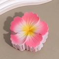 Top view of a matte pink gradient frangipani flower hair claw clip with yellow center - Sakura Pink Yellow Stamen