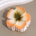 Close-up of frosted gradient frangipani hair claw with orange and green floral detail - Sakura Orange Green Stamen