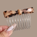Detail of tortoise shell acetate bow hair comb with silver metal teeth for elegant styling - Khaki Leopard Bow