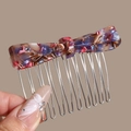 Detail of tortoiseshell bow hair comb featuring marble resin and silver metal teeth - Colorful Bow (Marble Pattern)