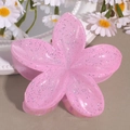 Close-up of pink glitter plumeria hair claw clip with floral resin texture details - Lily Pink