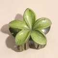 Olive green frangipani hair claw clip with dark ink splatter pattern and glossy finish - Ink Yellow Green