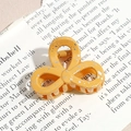 Detail of yellow flower hair claw clip with gold foil texture on vintage magazine background - Three-Petal Flower / Bright Yellow (Splash Ink)