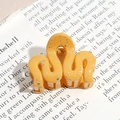 Minimalist yellow wavy hair claw clip with ink splash pattern on a magazine background - Wavy Line / Bright Yellow (Splash Ink)