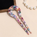 Detailed shot of acetate hair fork with marble pattern and anti-slip wavy design - Colorful