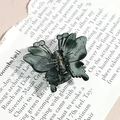 Detail of a dark green marble butterfly hair claw clip with a premium acetate finish - Dark Gray Butterfly