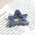 Detail of gray-blue star hair claw clip with silver glitter on vintage newsprint - Pentagram / Gray Blue (Splash Ink)