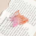 Détail de la pince à cheveux papillon évidée avec dégradé de rose à orange - Papillon Évidé Orange Rose