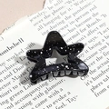 Macro view of star shaped hair claw clip with black galaxy texture and metal spring - Pentagram / Black (Splash Ink)