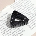 Macro view of black triangular hair claw with white ink splatter on newspaper background - Triangle / Glossy Black (Splash Ink)