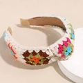 Close-up of crochet floral headband showing granny square knit pattern and khaki fabric lining - Colorful Square