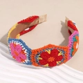 Close-up of colorful Bohemian crochet headband with floral knit patterns and soft lining - Blue and Orange Series