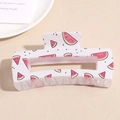 Close-up of a square cream hair claw clip with vibrant red watermelon pattern print - Watermelon