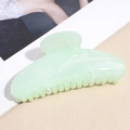 Dettaglio della pinza per capelli in acetato marmo verde a forma di luna su rivista - Verde