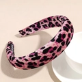 Detail view of pink leopard print sponge headband with velvet finish and handmade label - Rose Red Leopard