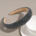 Detailed close-up of charcoal crystal beads and soft suede lining on a wide headband - Gray