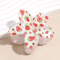 Detail shot of a white flower-shaped hair claw clip with realistic strawberry prints - Small Strawberry