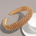 Detailed view of high-end champagne gold rhinestone headband with bead craftsmanship - Champagne