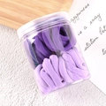 Purple gradient elastic hair ties set in a transparent jar on a wooden tray - Purple Series