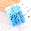 Blue gradient elastic hair ties set in a transparent storage jar on a wooden tray - Blue Series