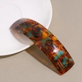 Detailed close-up of tortoise shell acetate spring hair clip with gold France Handmade logo - Tortoise
