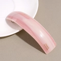 Detail of pink marble acetate barrette with gold France Handmade logo engraving - Pink