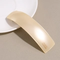 Close-up of handmade acetate hair clip with matte texture and France Handmade logo - Gold
