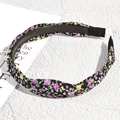 Detail of floral knotted headband with anti-slip teeth and purple yellow flower pattern - Black Floral Purple