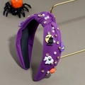 Detail of purple knotted Halloween headband with pumpkin, ghost, pearls and rhinestones - Purple