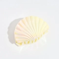 Detail of seashell hair claw clip with holographic pearlescent finish and shark clip design - Iridescent Yellow