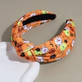 Detail shot of Halloween wide knotted headband with pumpkin and ghost prints on orange fabric - Plain Orange
