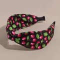 Detail of a wide twisted headband with a sweet red cherry print on black fabric - Small Cherry Black
