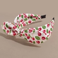 Detail of white cotton headband featuring red cherry prints and a cute bow tie knot - Rabbit Ear Small Cherry White
