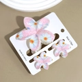 Dettaglio di fermagli per capelli floreali rosa con stampa margherite e molletta chic - Fiore Bianco Rosa / Set di 3 pezzi