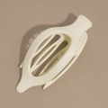 Detail view of cream white matte oval hair claw clip with interlocking teeth for thick hair - Off White