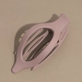 Detail of matte finish hair claw clip in soft mauve with hollow oval design - Deep Pink