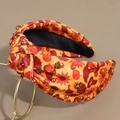 Close-up of Thanksgiving headband featuring maple leaves, turkeys, rhinestones and pearls - Rhinestone Orange Hat Turkey
