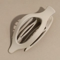 Close-up of a matte beige oval hair claw clip with a hollow geometric design - Gray