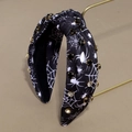 Macro detail of Halloween headband with spider web pattern and sparkling rhinestones - Spider Web Black