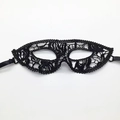 Detailed macro shot of black lace fox mask with intricate cutout patterns for Halloween decor - Mask 5