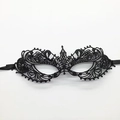 Close-up of black lace fox mask with intricate baroque embroidery and satin ribbons - Mask 8