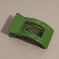 Detailed view of large dark green hair claw clip with glossy resin finish and spring mechanism - Glossy Green