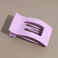 Detail view of a matte light purple flat hair claw clip with stylish curved hollow teeth - Glossy Purple
