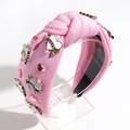 Roze geknoopte hoofdband met hartkristallen en witte parels voor een vintage look - Roze
